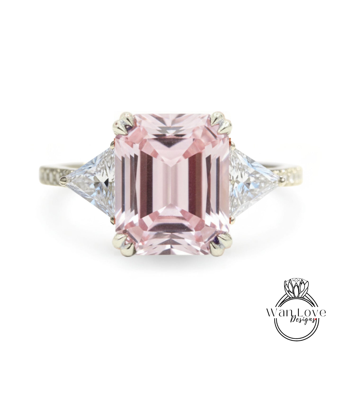 A pink gemstone engagement ring with a diamond-encrusted band.