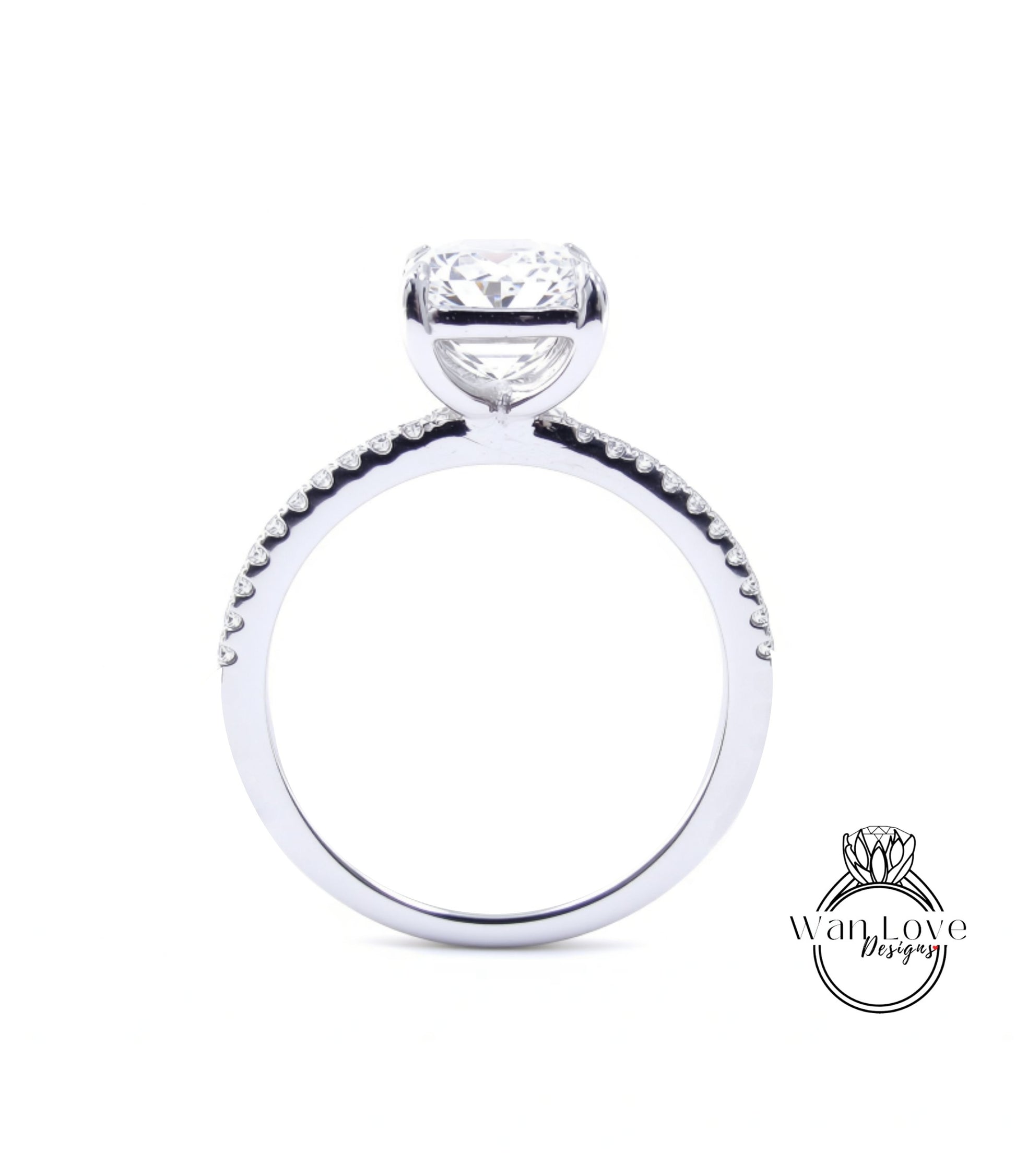 A close-up view of a diamond engagement ring with a large central diamond and smaller diamonds around the band.