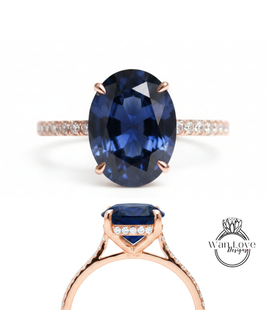 a beautiful blue gemstone ring with a large oval-shaped blue gemstone set in a rose gold band.