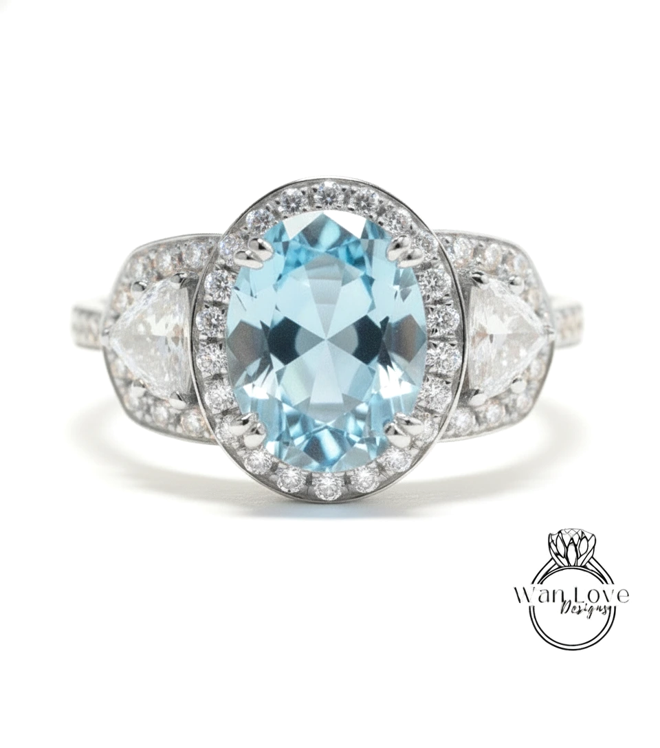 A stunning blue aquamarine gemstone ring adorned with a halo of sparkling diamonds, set in a silver band.