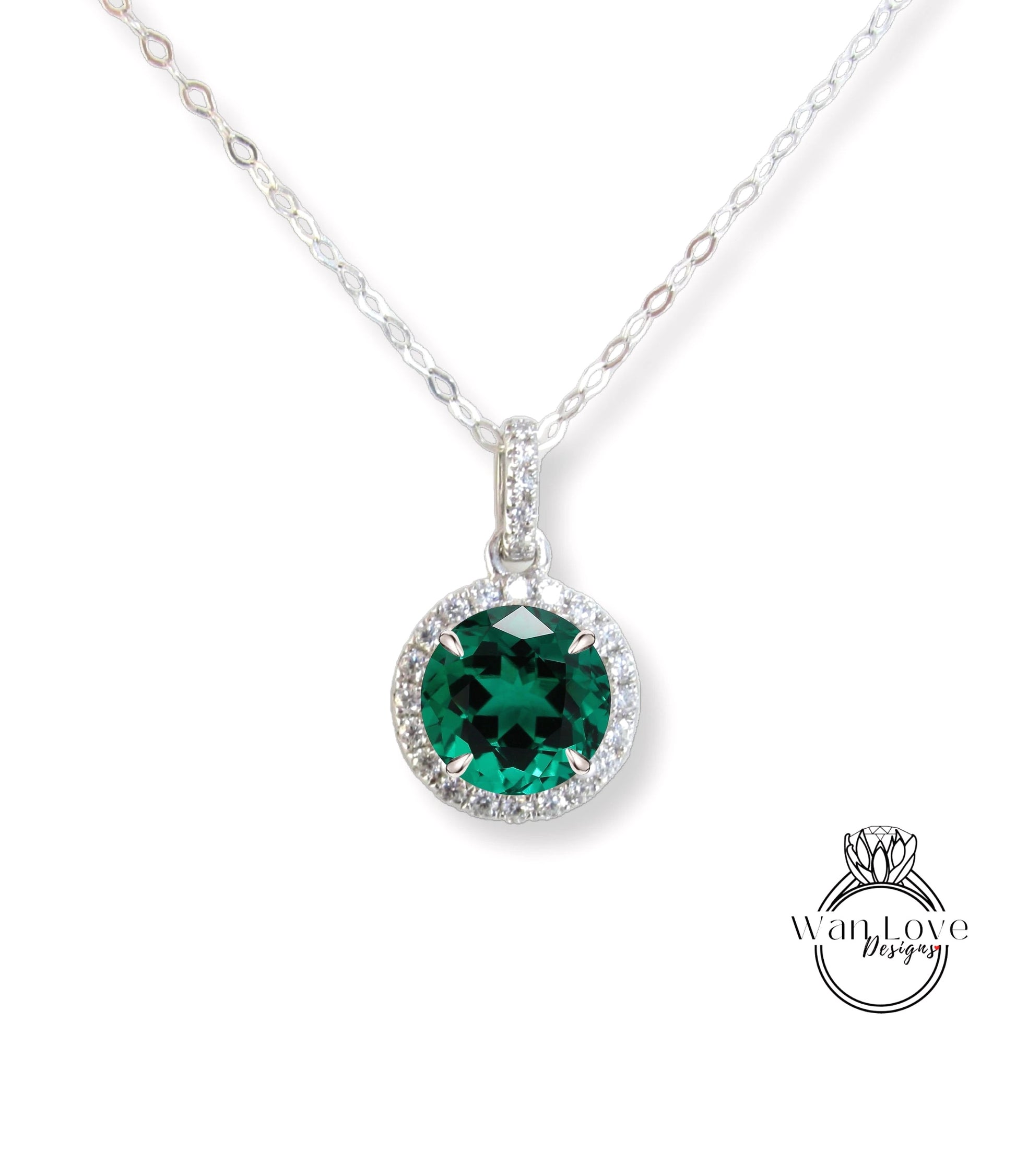 A necklace with a large, green gemstone pendant.