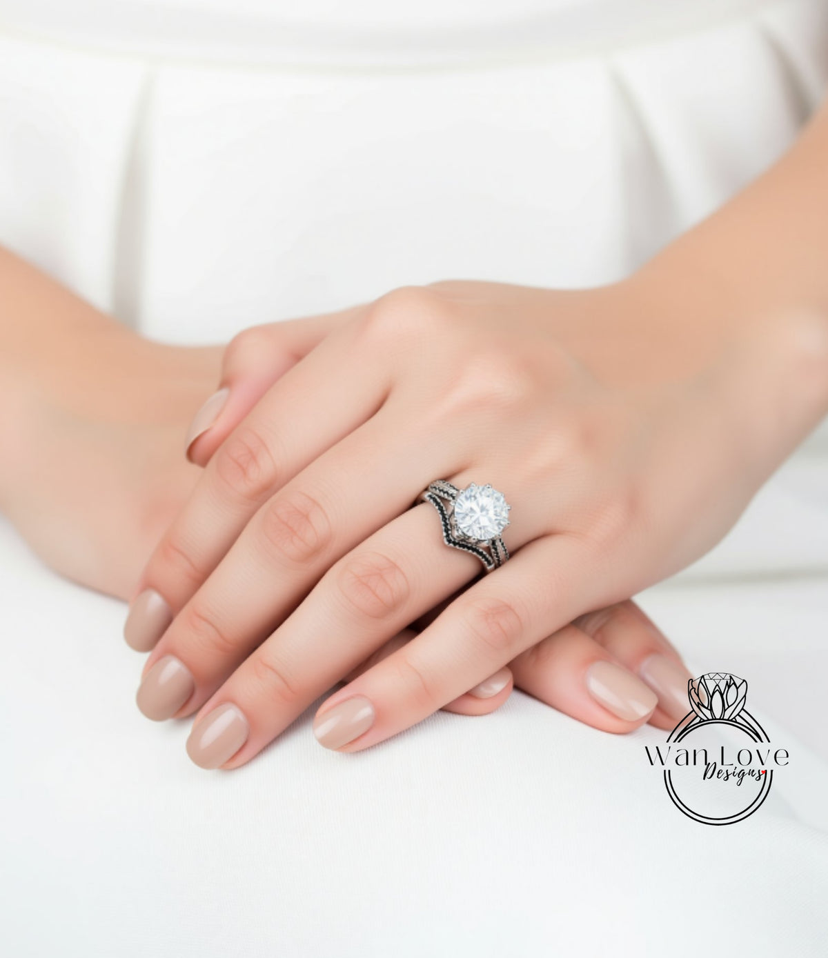 A close-up of a person's hand wearing a large diamond engagement ring.