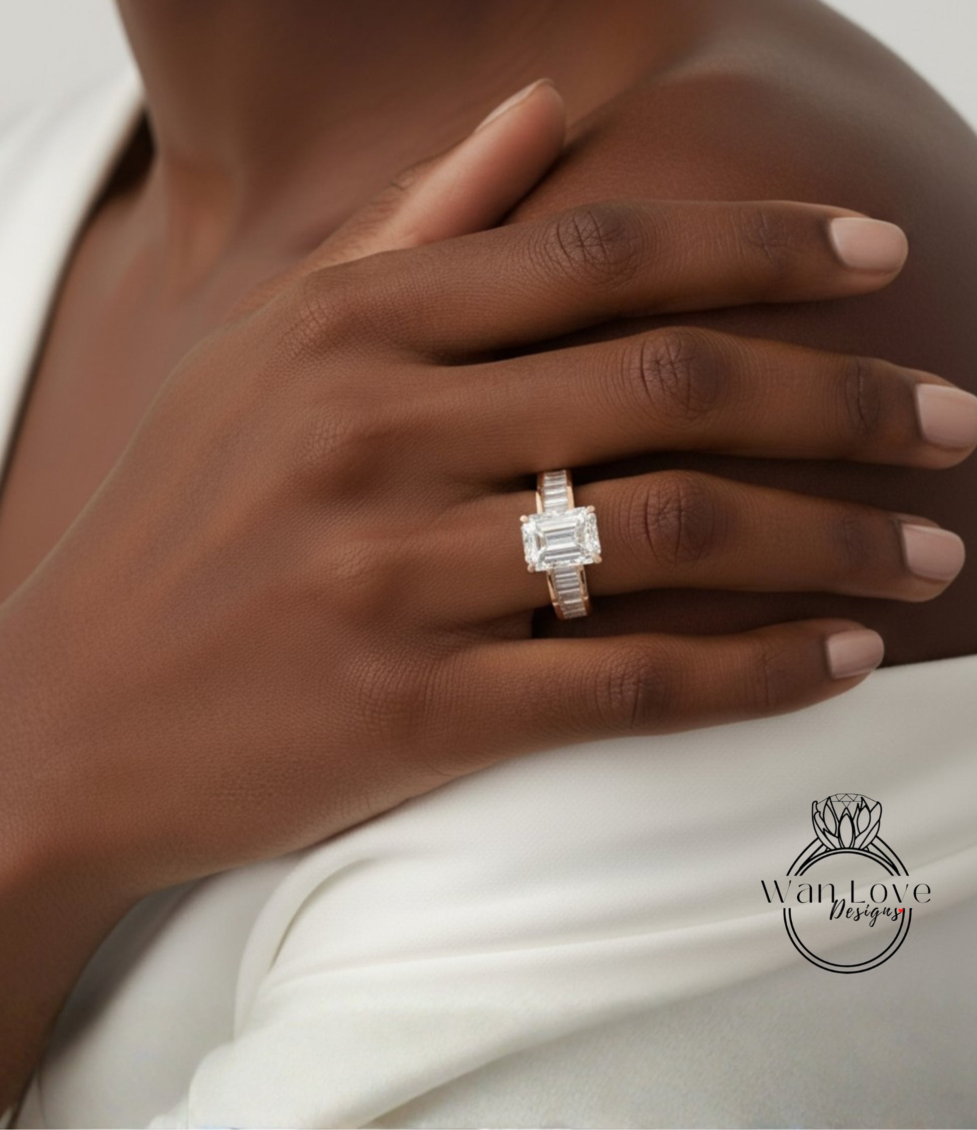 A close-up of a person's hand wearing a diamond engagement ring.
