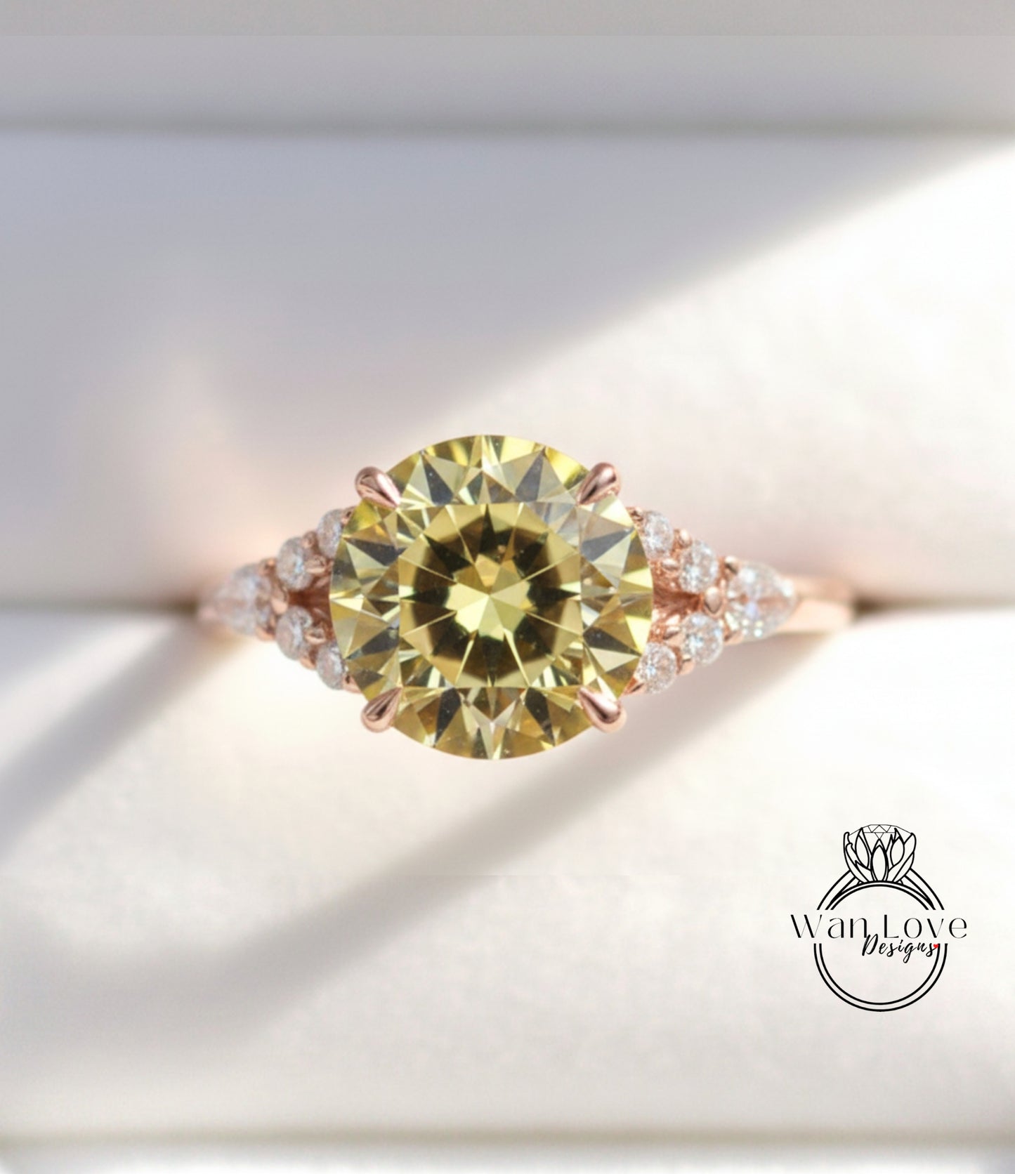 A close-up image of a gold ring with a large yellow diamond as the centerpiece, surrounded by smaller diamonds.