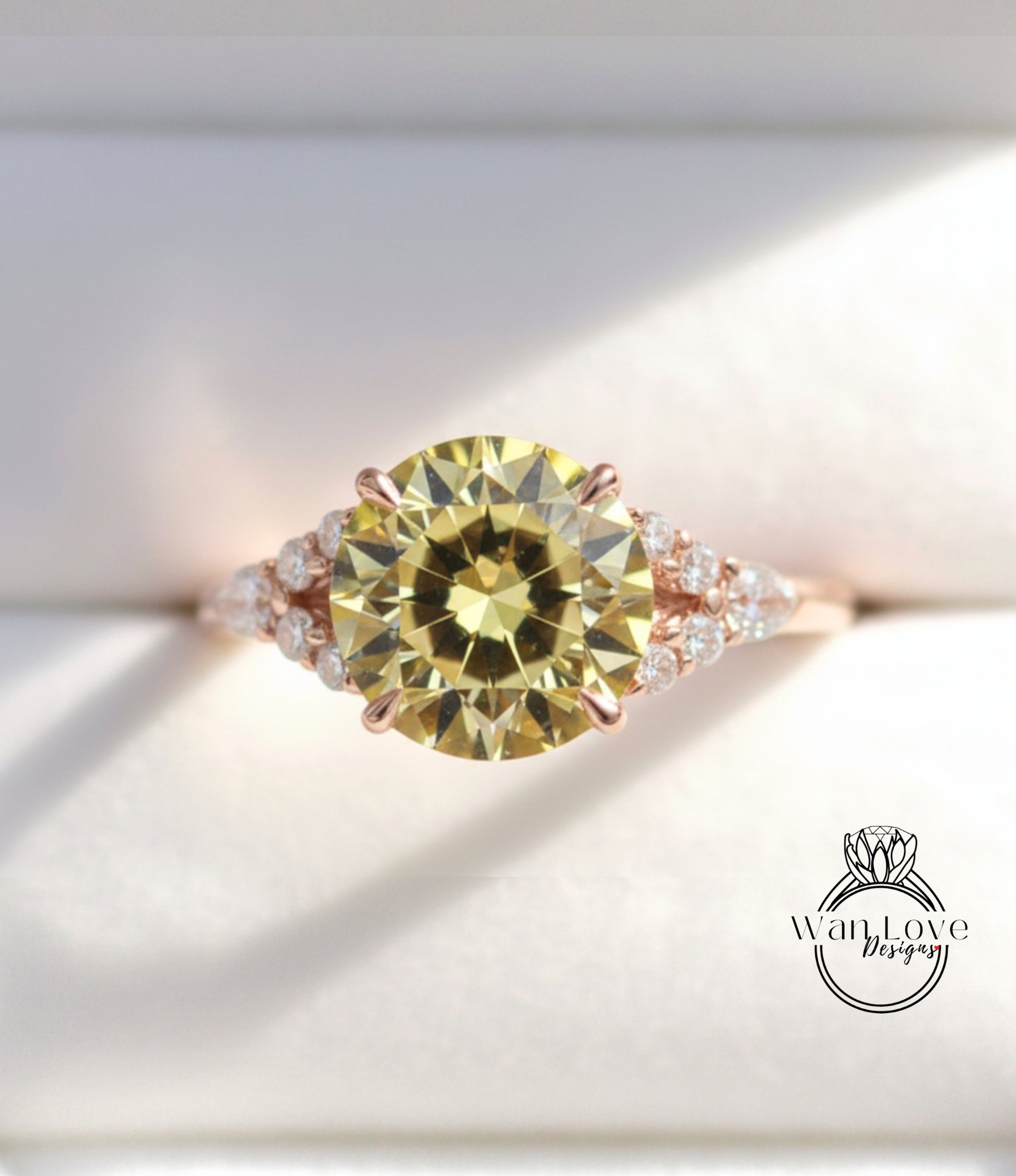 A close-up image of a gold ring with a large yellow diamond as the centerpiece, surrounded by smaller diamonds.
