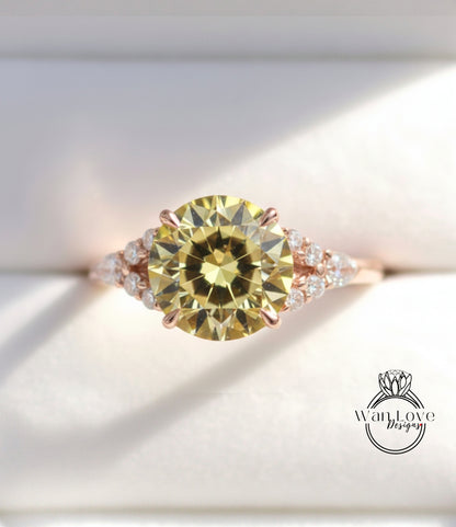 A close-up image of a gold ring with a large yellow diamond as the centerpiece, surrounded by smaller diamonds.