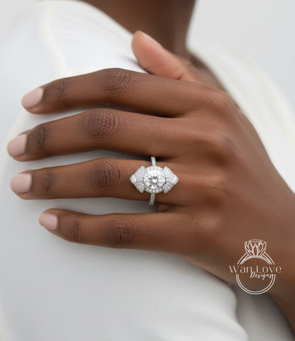 A close-up of a person's hand wearing a large, ornate diamond ring on the ring finger.