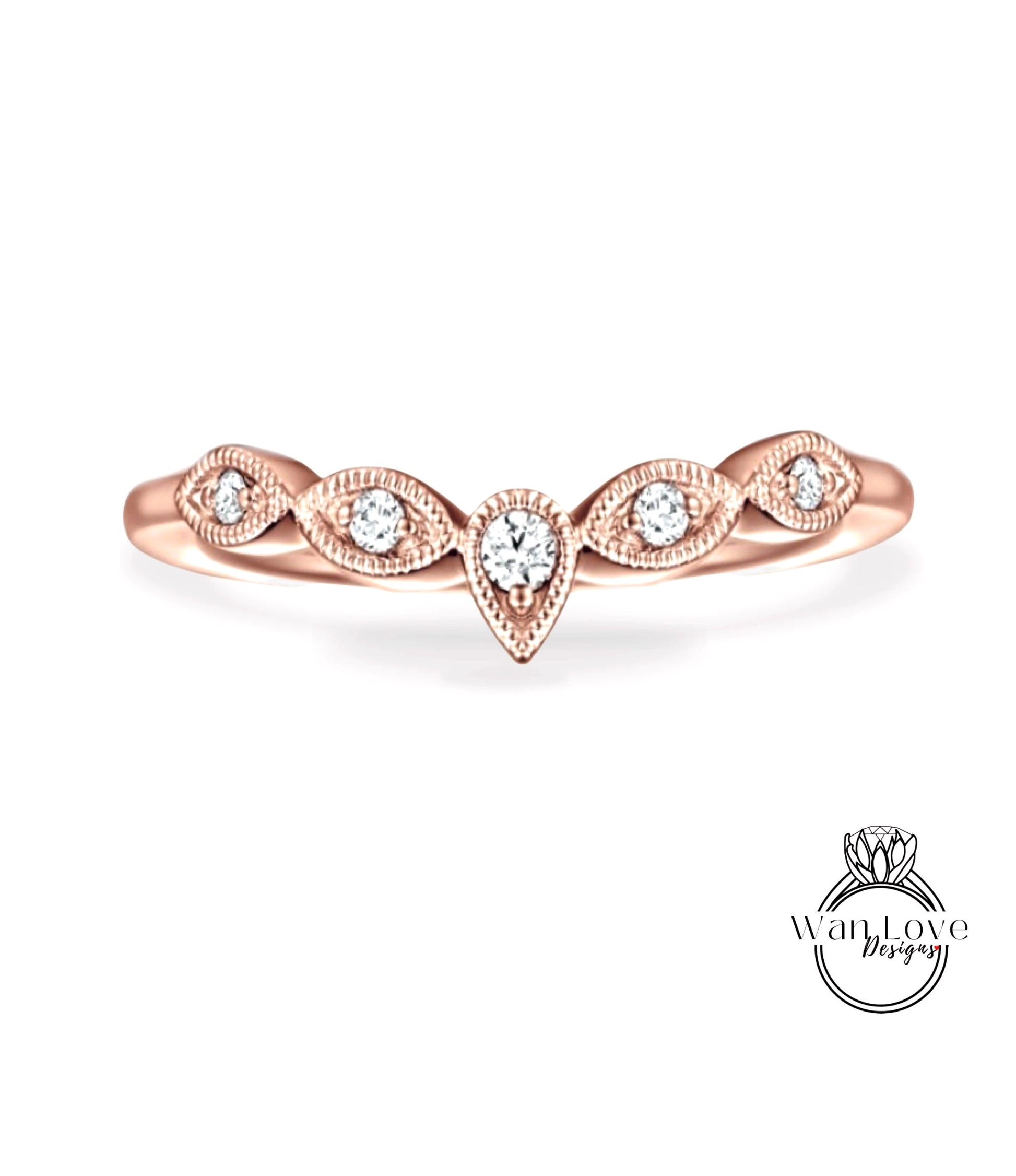 A rose gold ring with a central diamond and smaller diamonds arranged in a decorative pattern around the band.