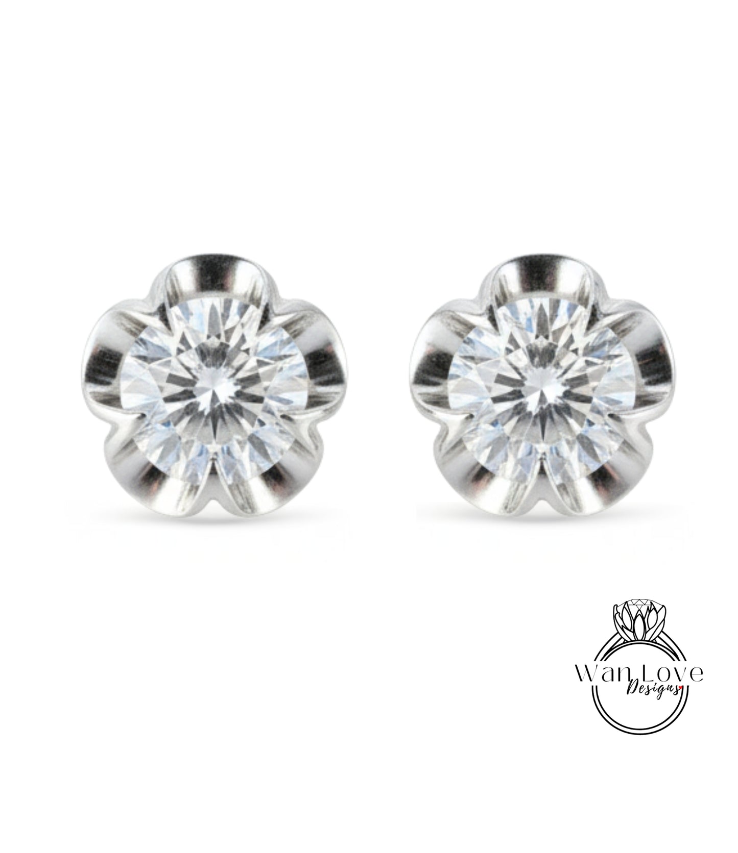 A pair of elegant silver earrings with a large, clear gemstone set in a flower-shaped design.