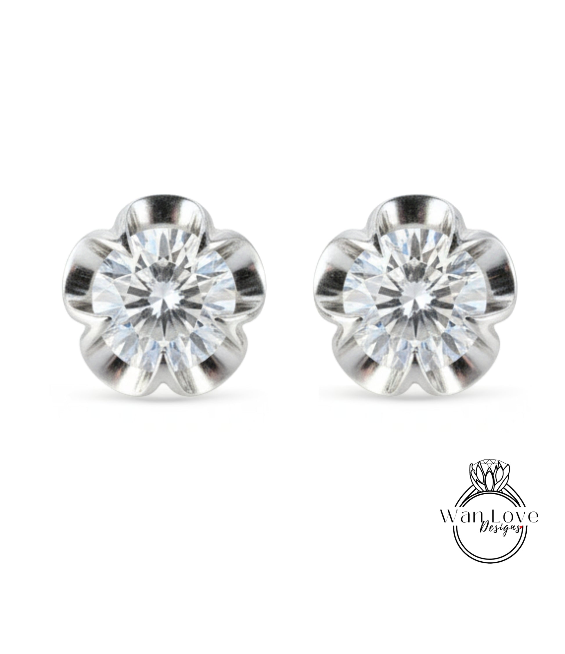 A pair of elegant silver earrings with a large, clear gemstone set in a flower-shaped design.