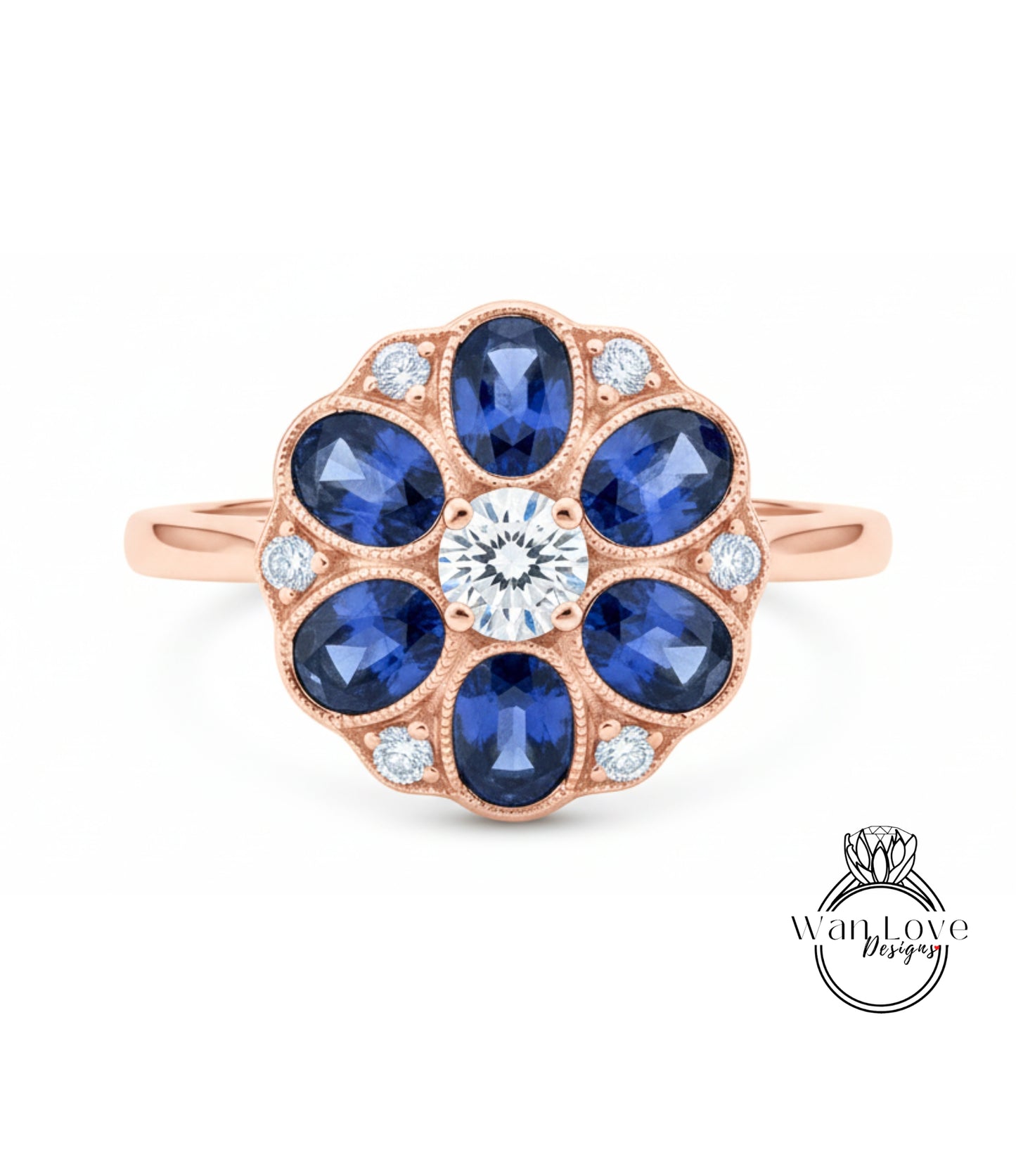 a beautiful rose gold ring with a large central diamond surrounded by smaller diamonds, set in a blue sapphire flower design.