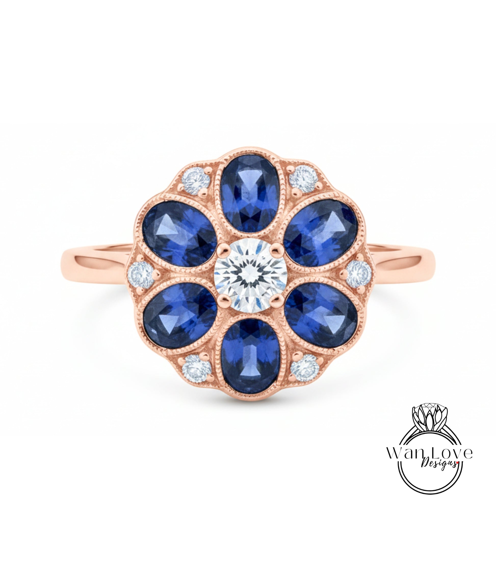 a beautiful rose gold ring with a large central diamond surrounded by smaller diamonds, set in a blue sapphire flower design.