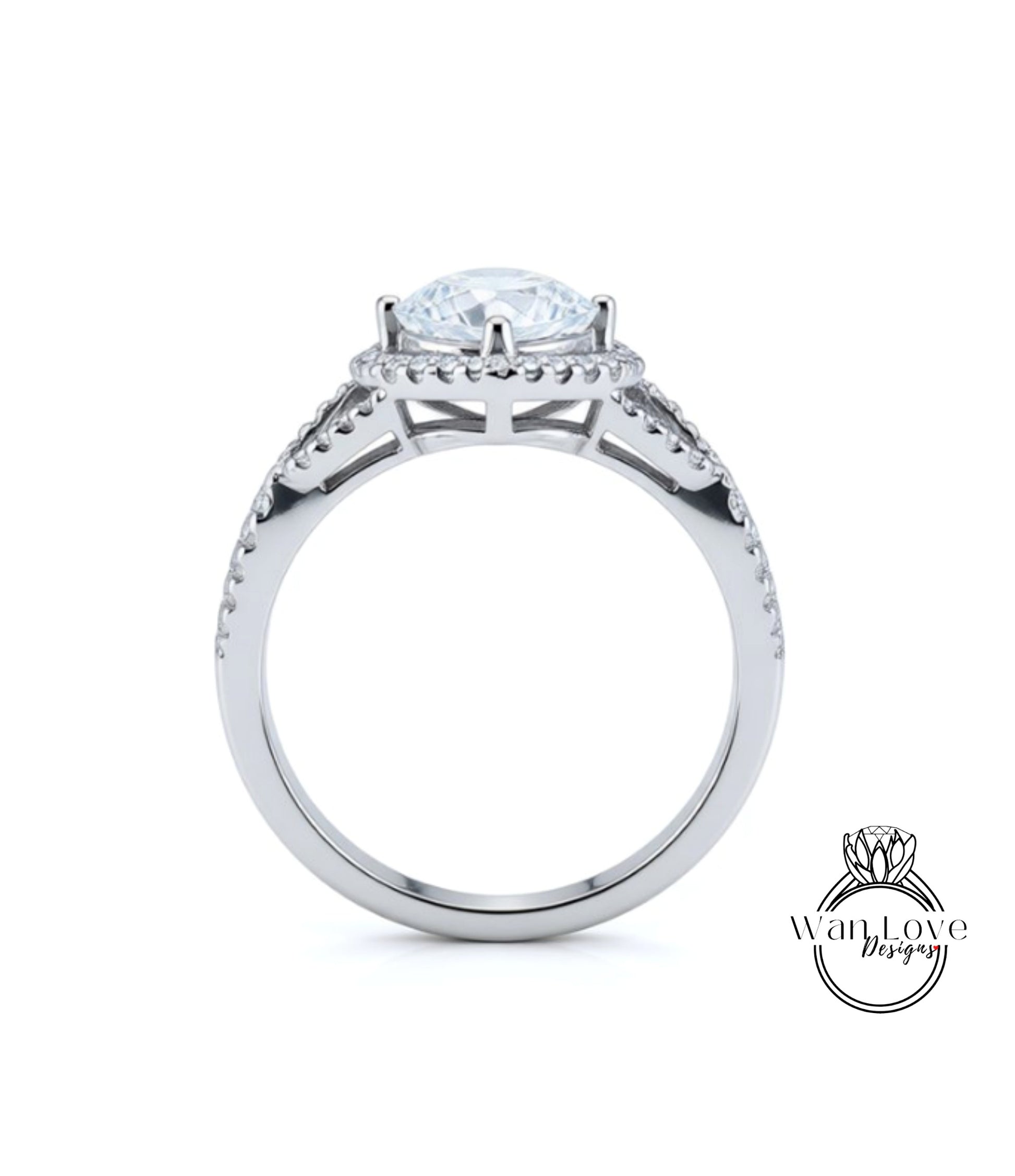 A silver engagement ring with a large central diamond surrounded by smaller diamonds on either side.