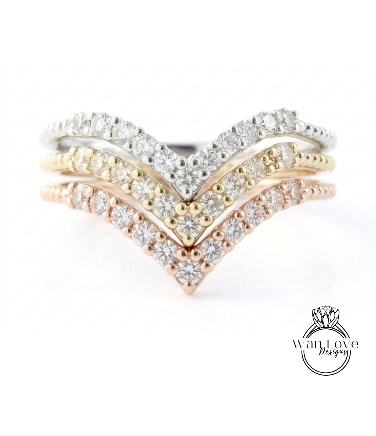 A ring with a diamond-encrusted band featuring three distinct diamond-encrusted tiers, with the middle tier being the largest and the bottom tier being the smallest.