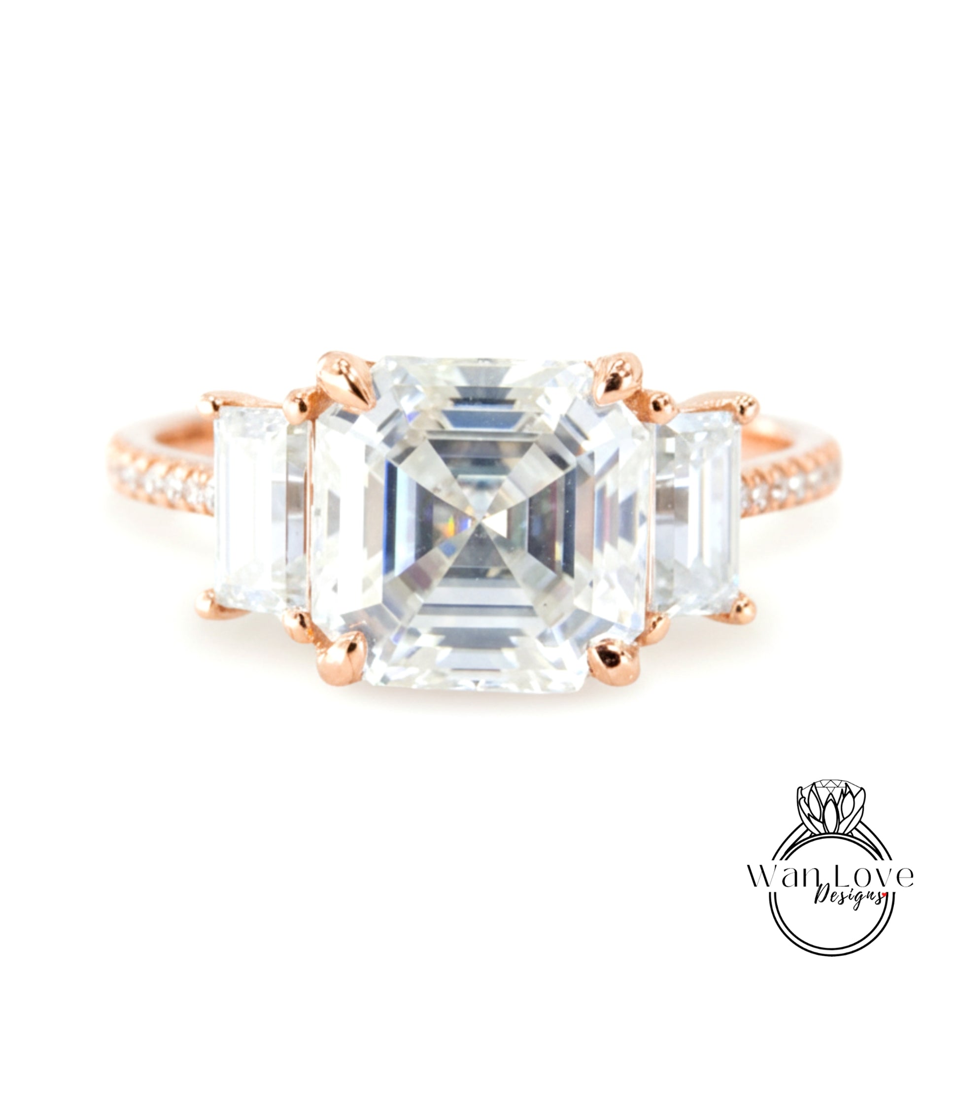 A large, clear gemstone ring with three smaller diamonds set in the center.