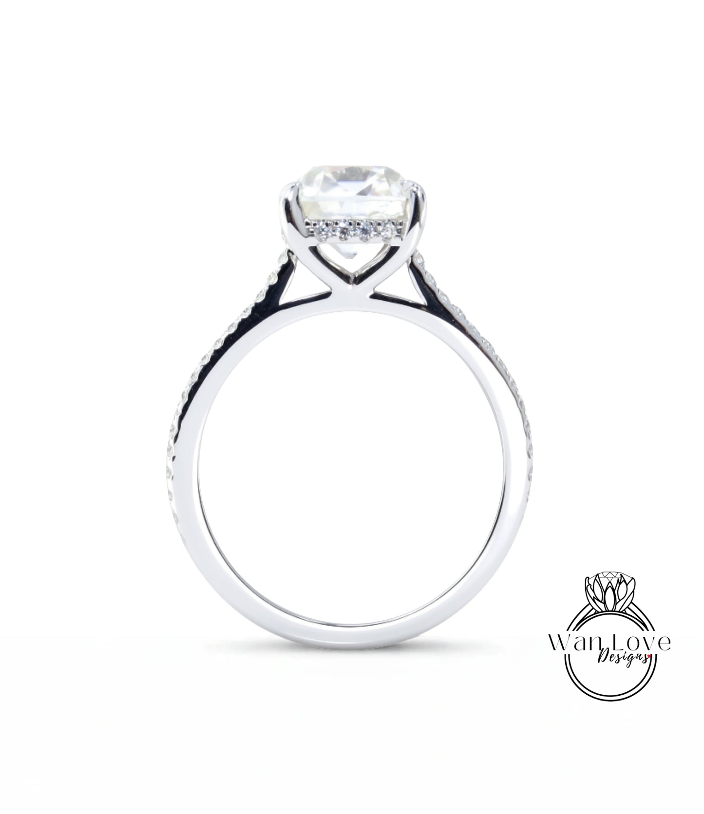 A silver engagement ring with a large diamond set in the center, surrounded by smaller diamonds.