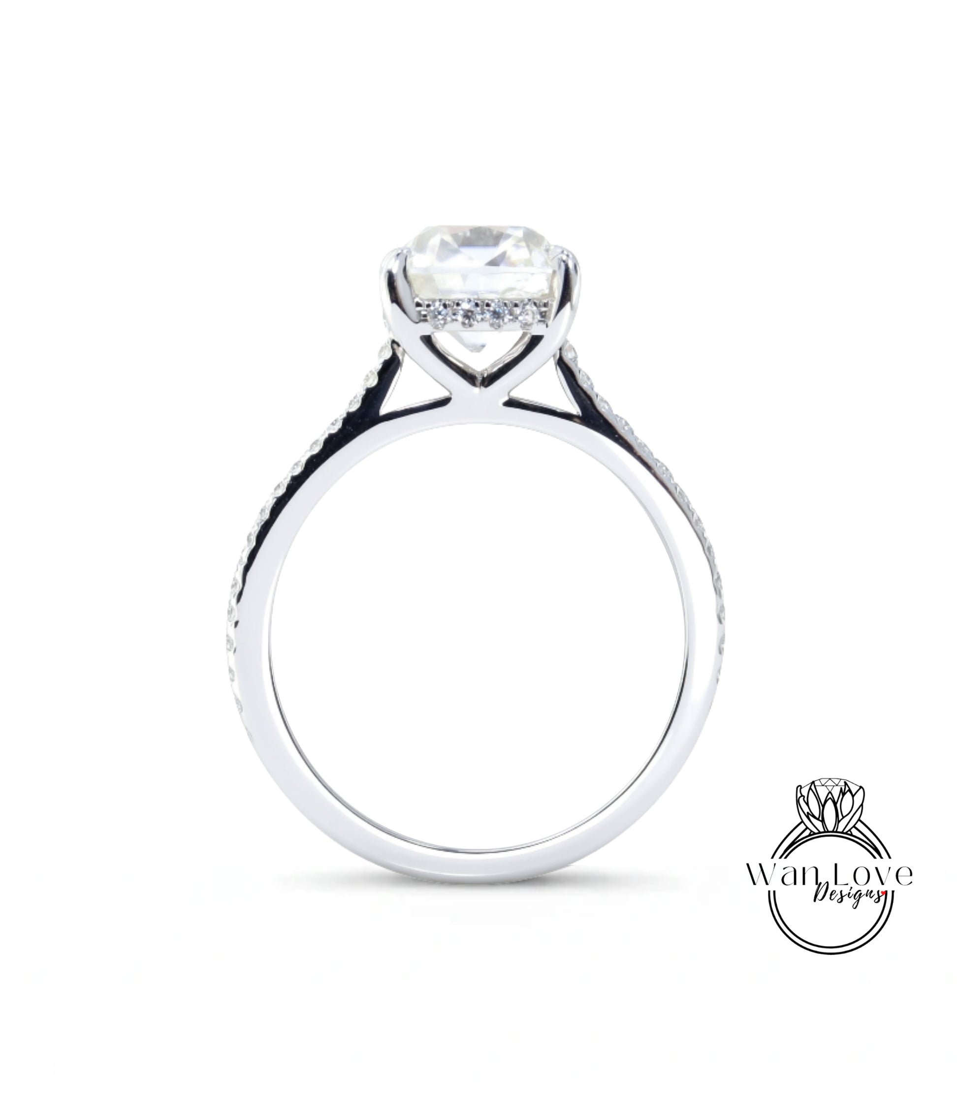 A silver engagement ring with a large diamond set in the center, surrounded by smaller diamonds.