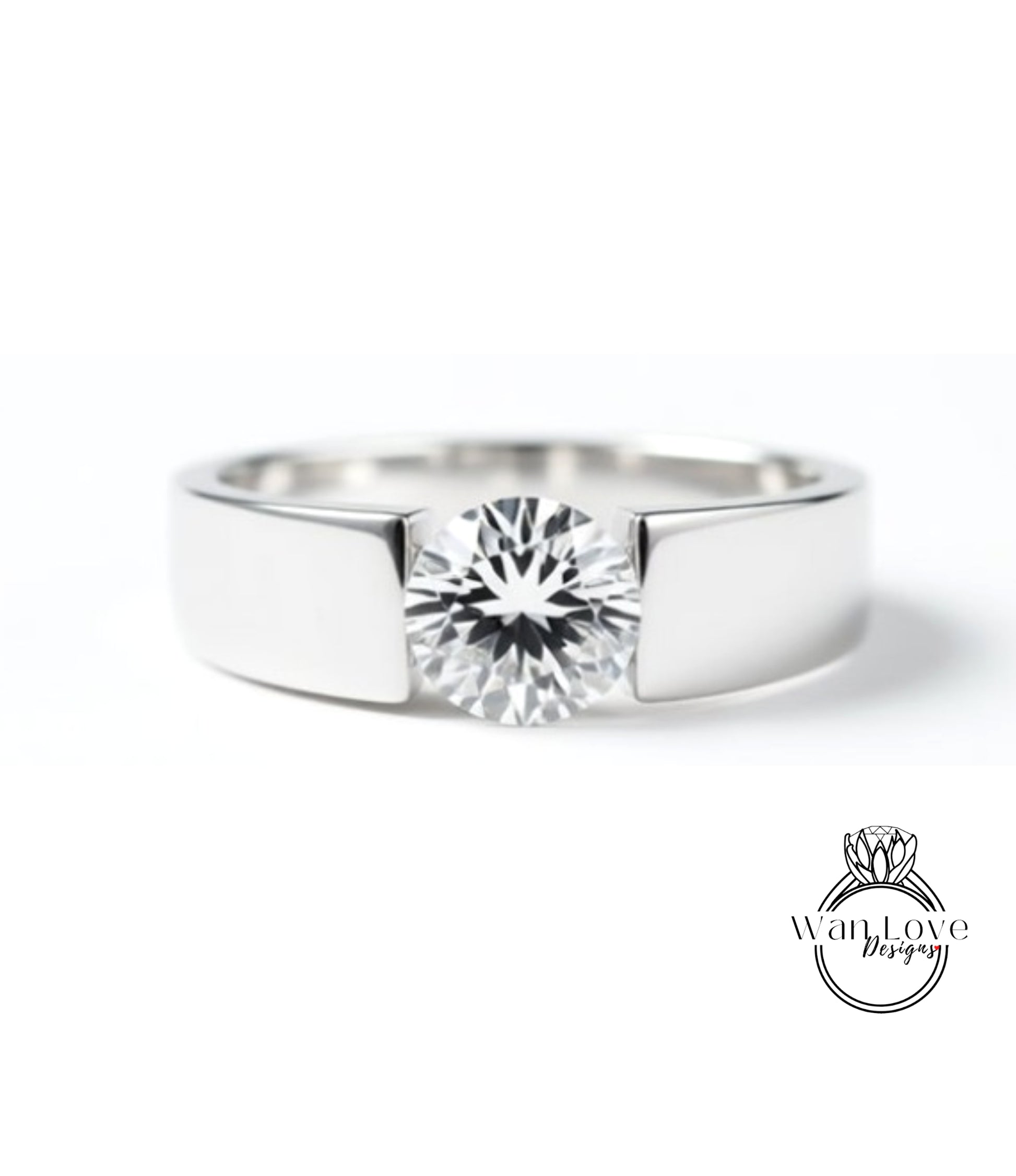 A close-up view of a silver ring with a large, clear diamond set in the center.