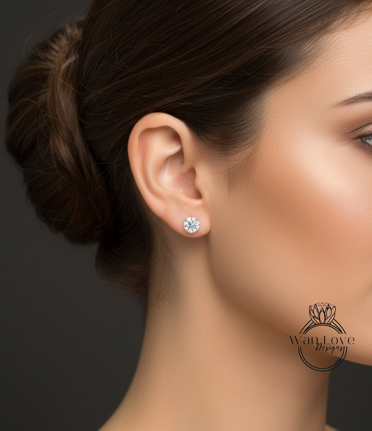 A close-up of a woman's face, focusing on her ear with a diamond earring.