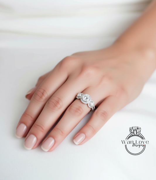 A close-up of a hand wearing a diamond ring on the ring finger.