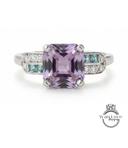 a ring with a large purple gemstone, surrounded by smaller blue gemstones.