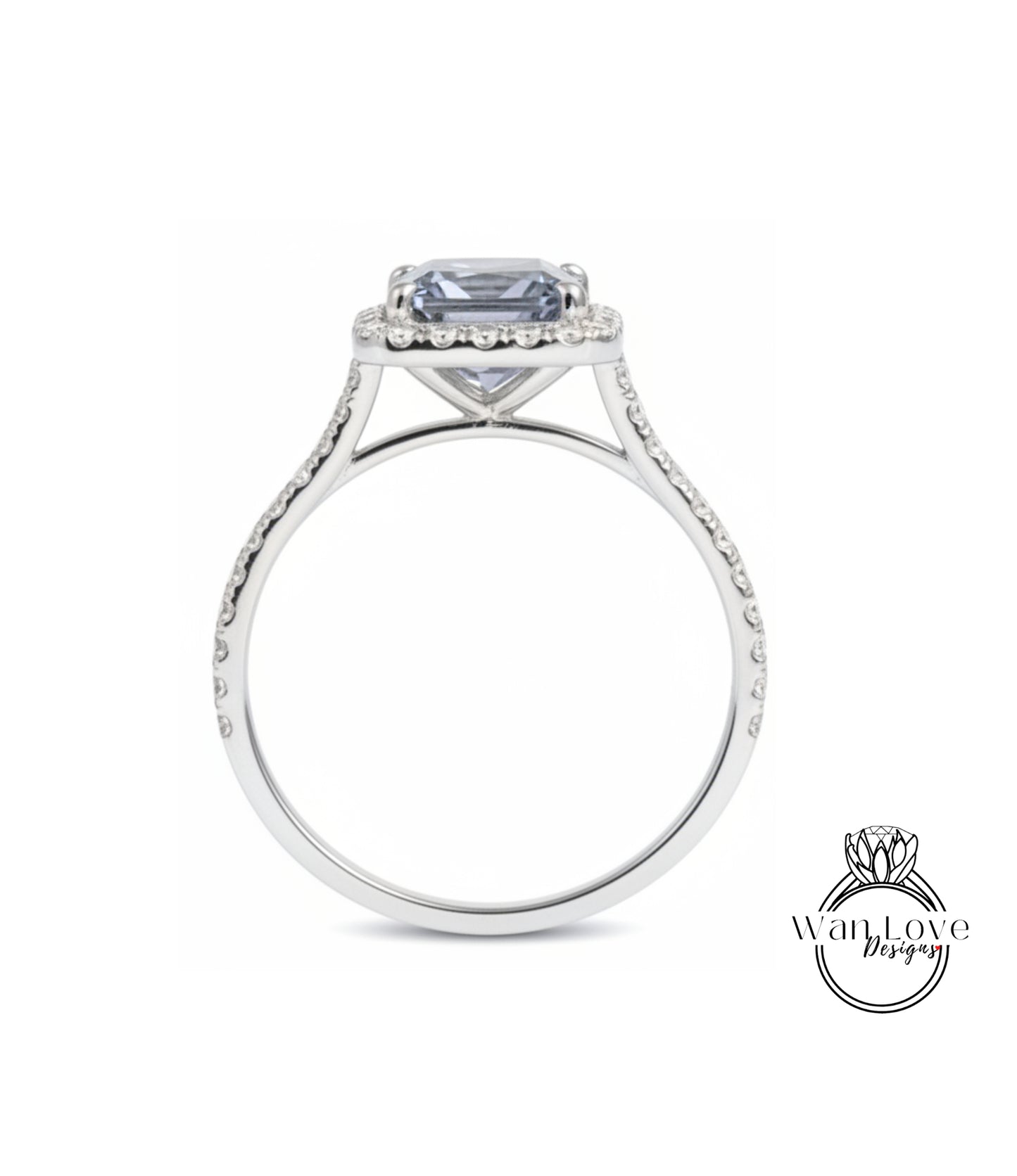 A silver engagement ring with a large blue gemstone set in the center, surrounded by smaller diamonds.