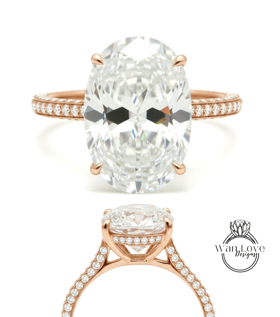 a large, oval-shaped diamond engagement ring with a rose gold band and a row of small diamonds along the band.