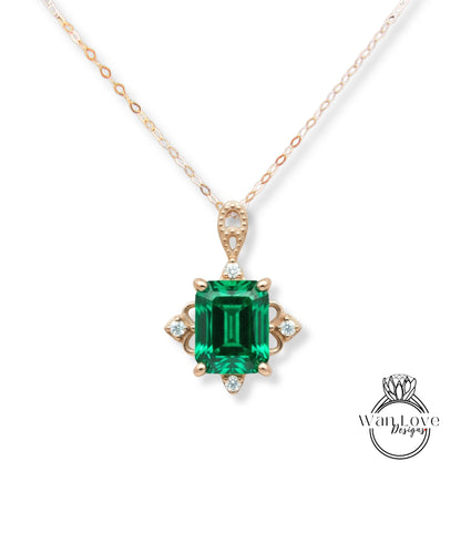A necklace with a large, green gemstone pendant.
