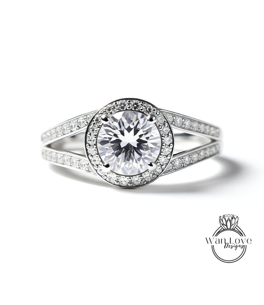 A close-up view of a diamond engagement ring with a large central diamond surrounded by smaller diamonds set in a halo.