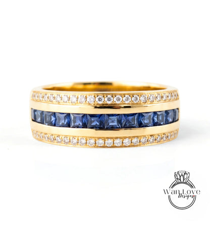 A gold ring with a band of blue gemstones and a row of diamonds along the band.