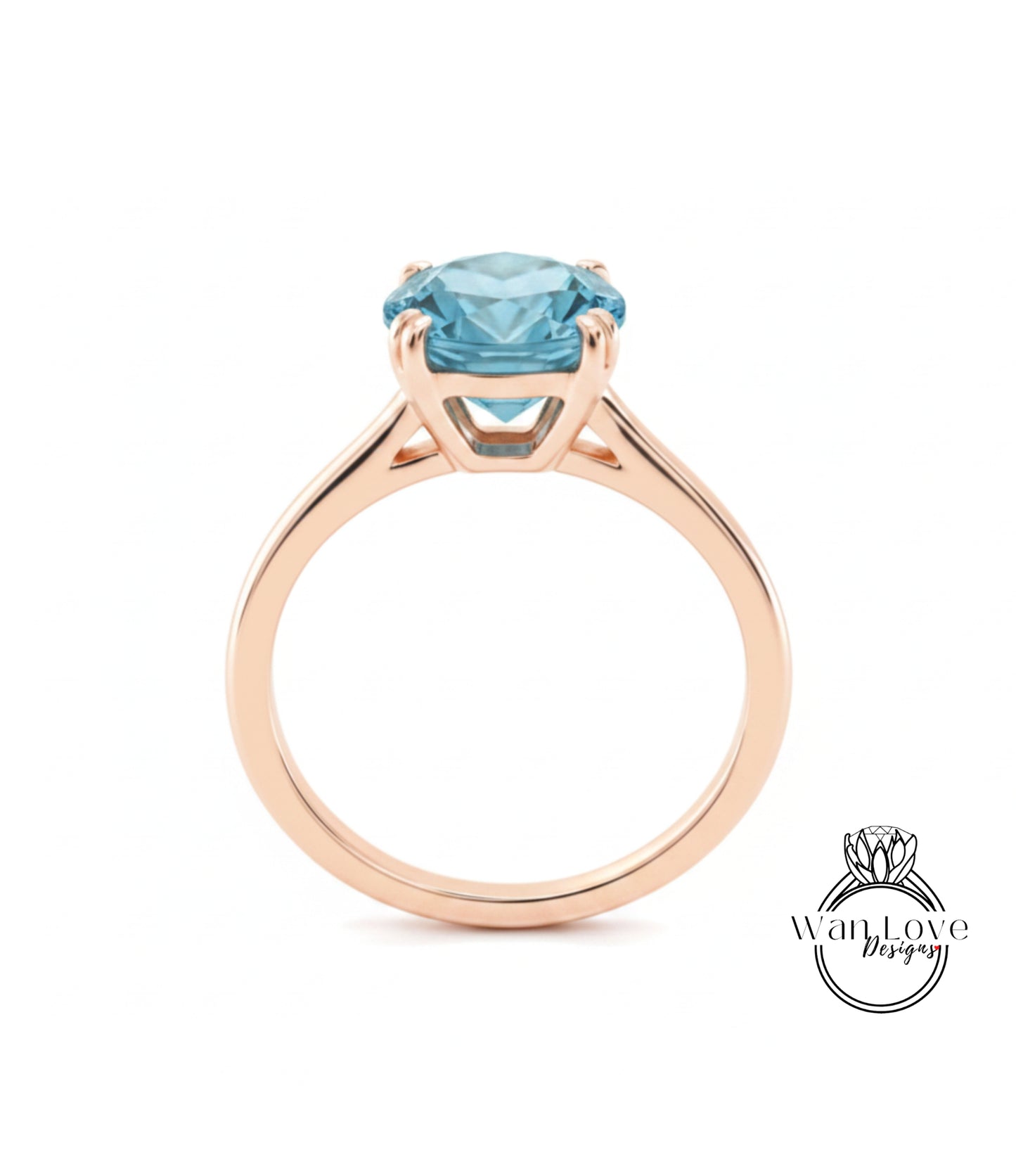 A gold ring with a large blue gemstone set in the center.