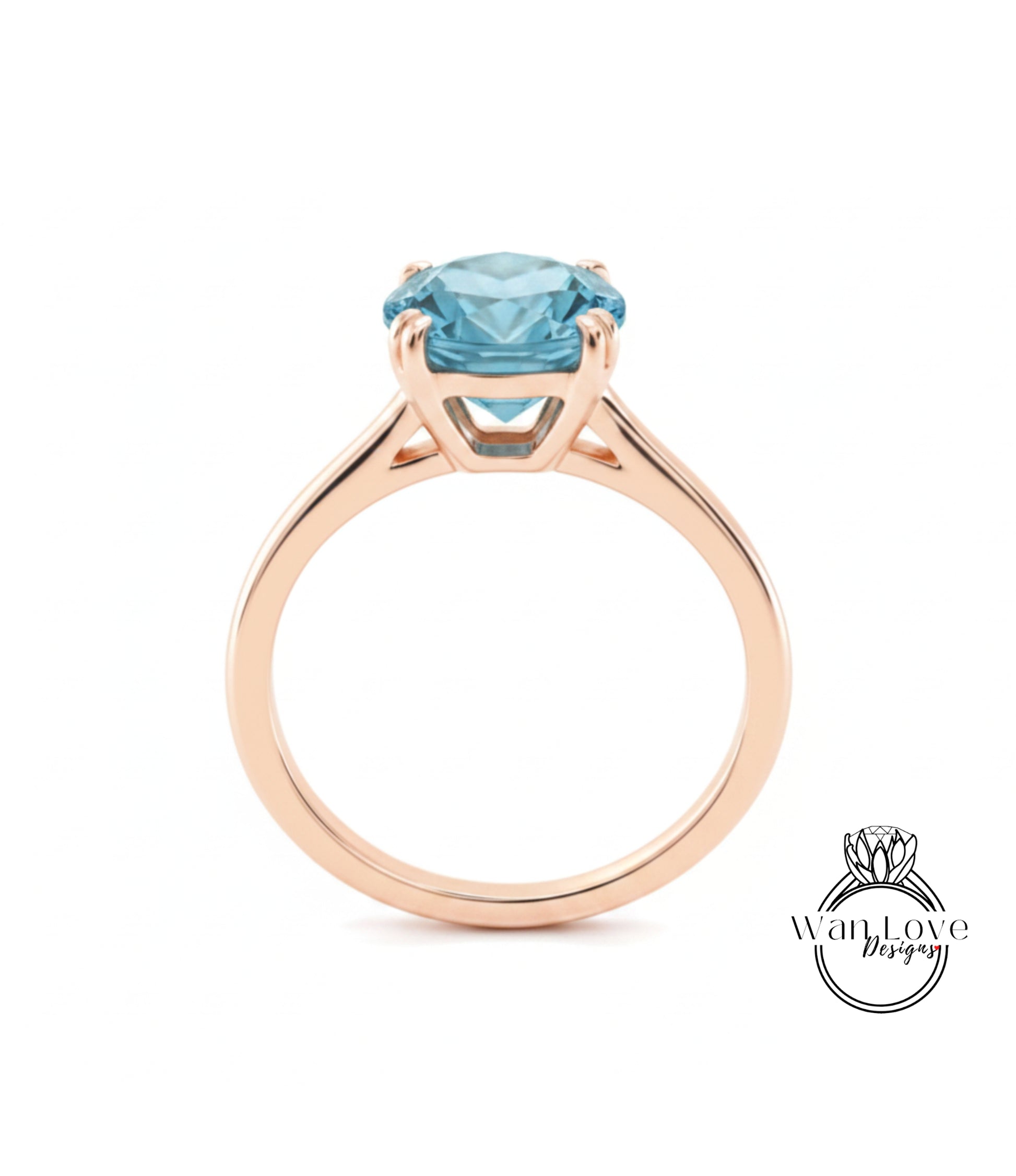 A gold ring with a large blue gemstone set in the center.