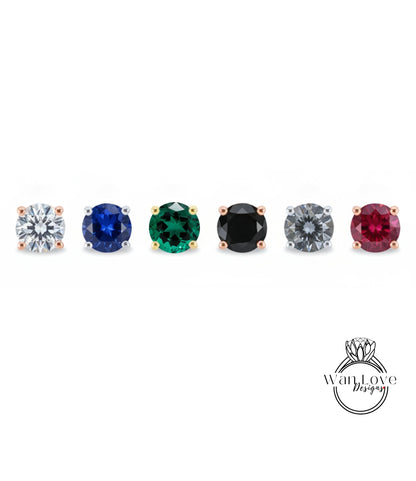 a collection of six different colored gemstones, including diamonds, arranged in a row.