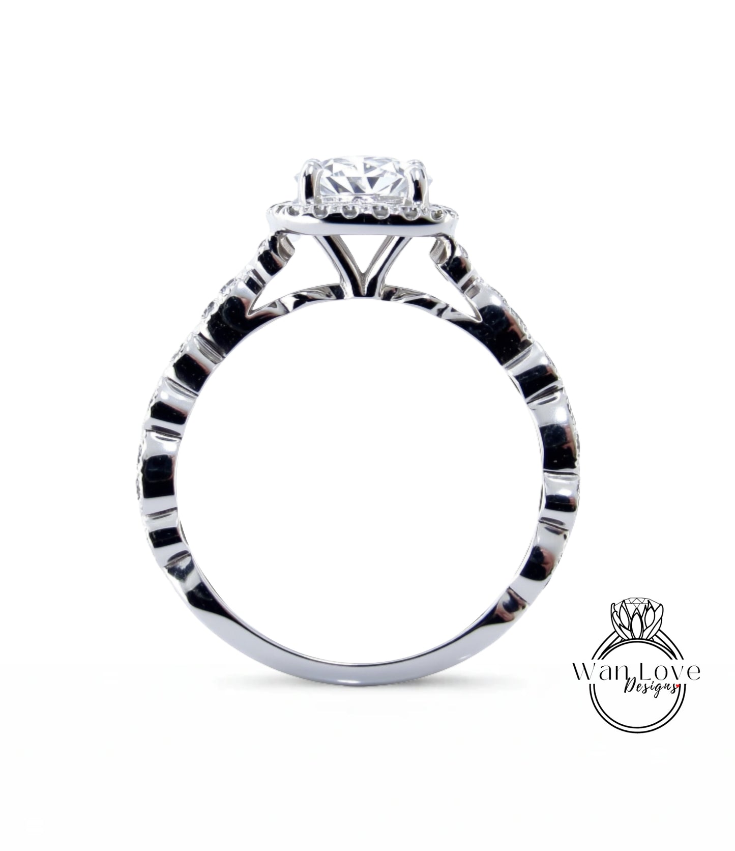 A close-up view of a silver engagement ring with a large central diamond surrounded by smaller diamonds.