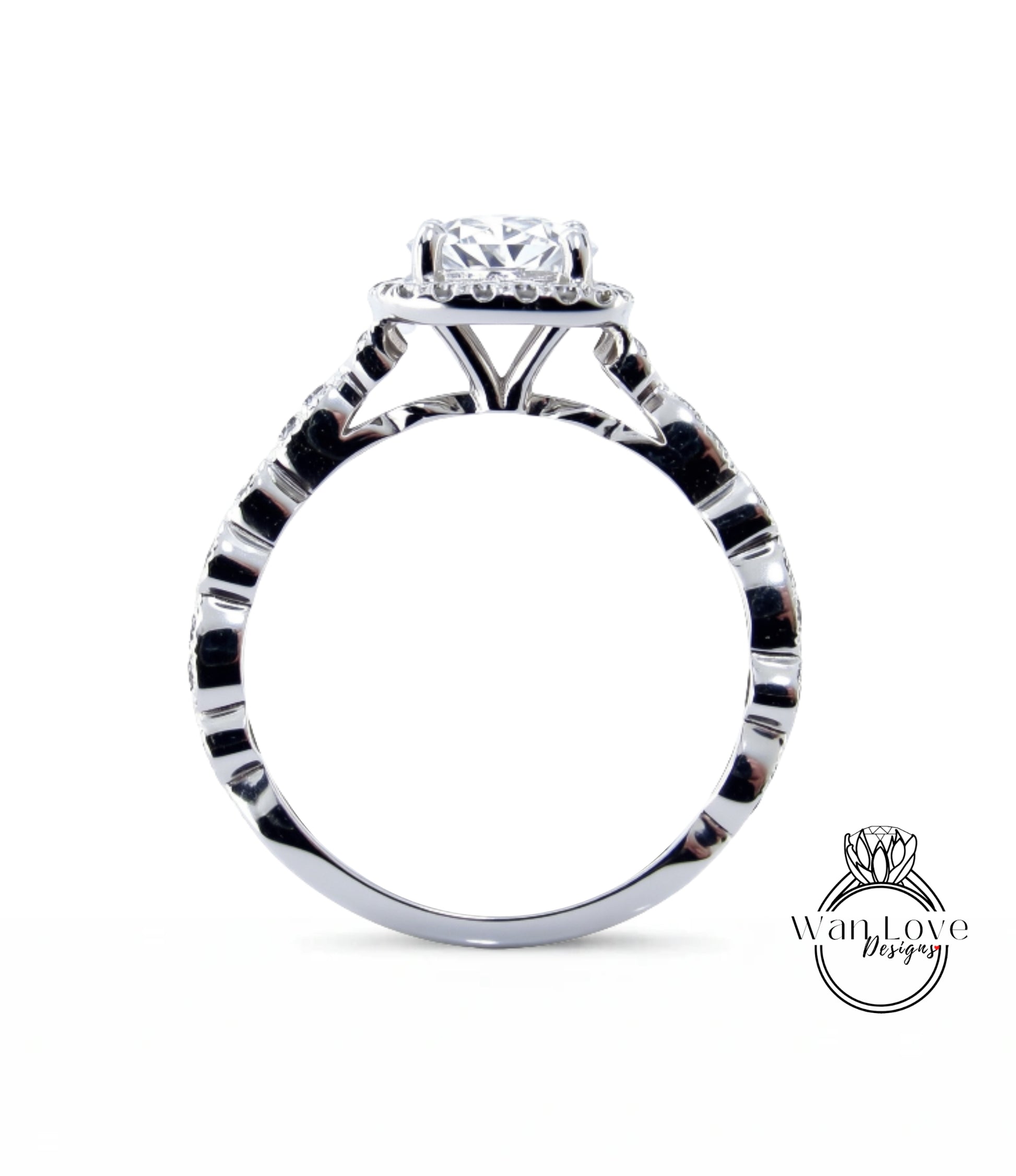 A close-up view of a silver engagement ring with a large central diamond surrounded by smaller diamonds.