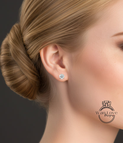A close-up of a woman's face, focusing on her ear with a diamond earring.