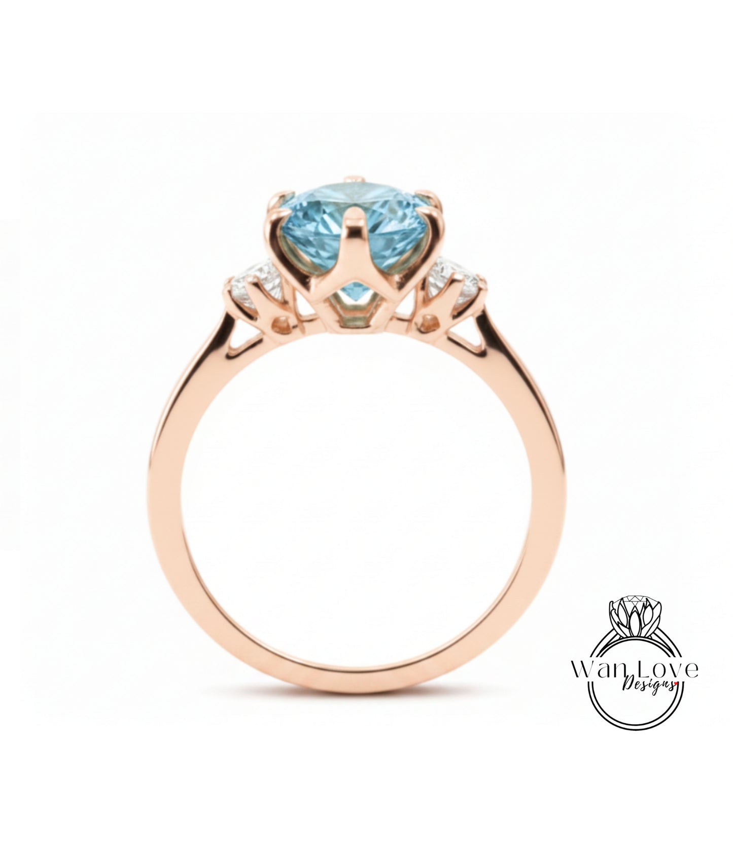 A gold ring with a large blue gemstone, possibly a sapphire, set in the center.