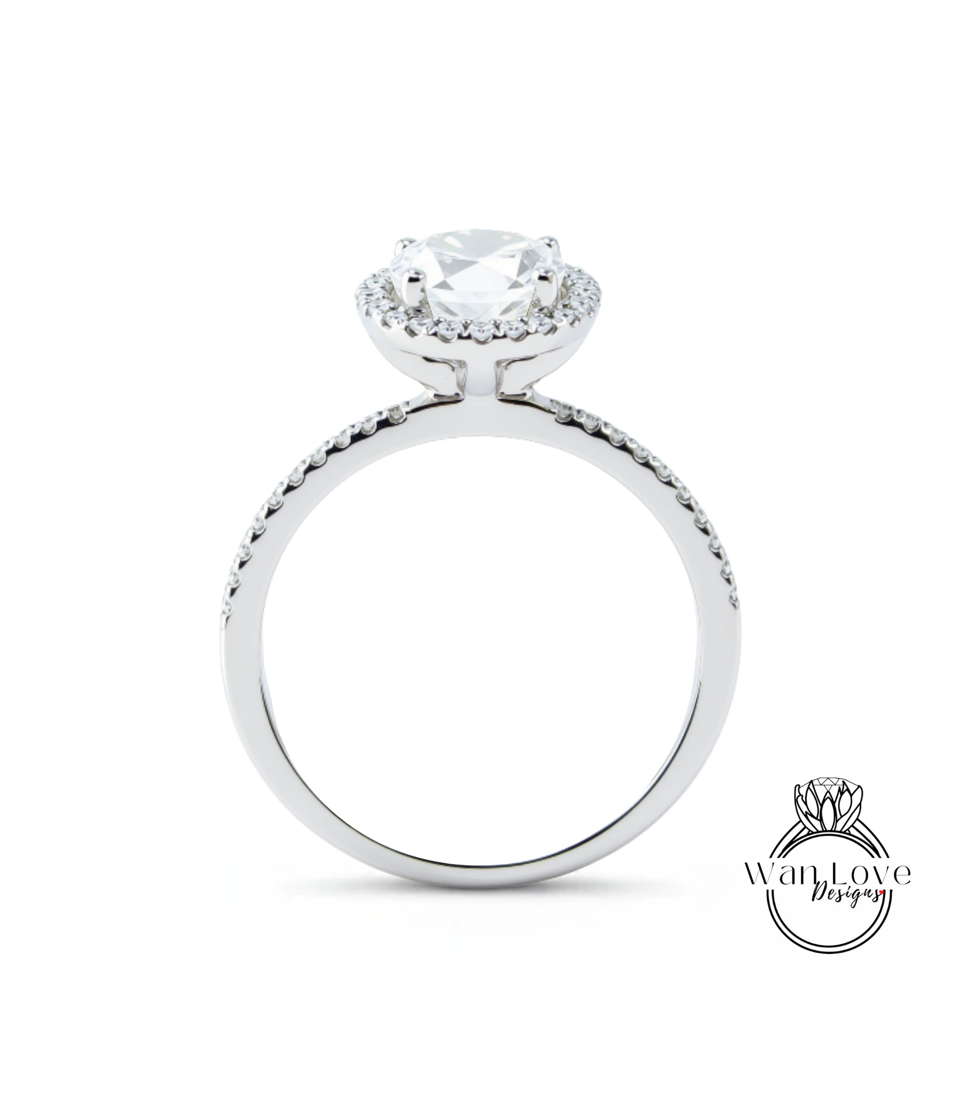 A silver engagement ring with a large central diamond surrounded by smaller diamonds, set in a halo of smaller diamonds.