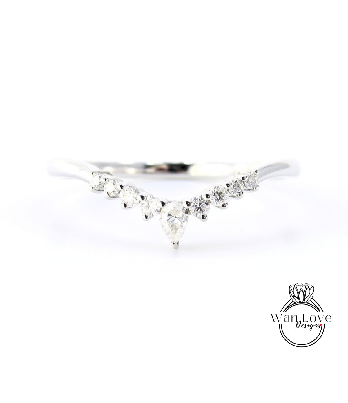 A silver ring with a large central diamond surrounded by smaller diamonds arranged in a v-shape.