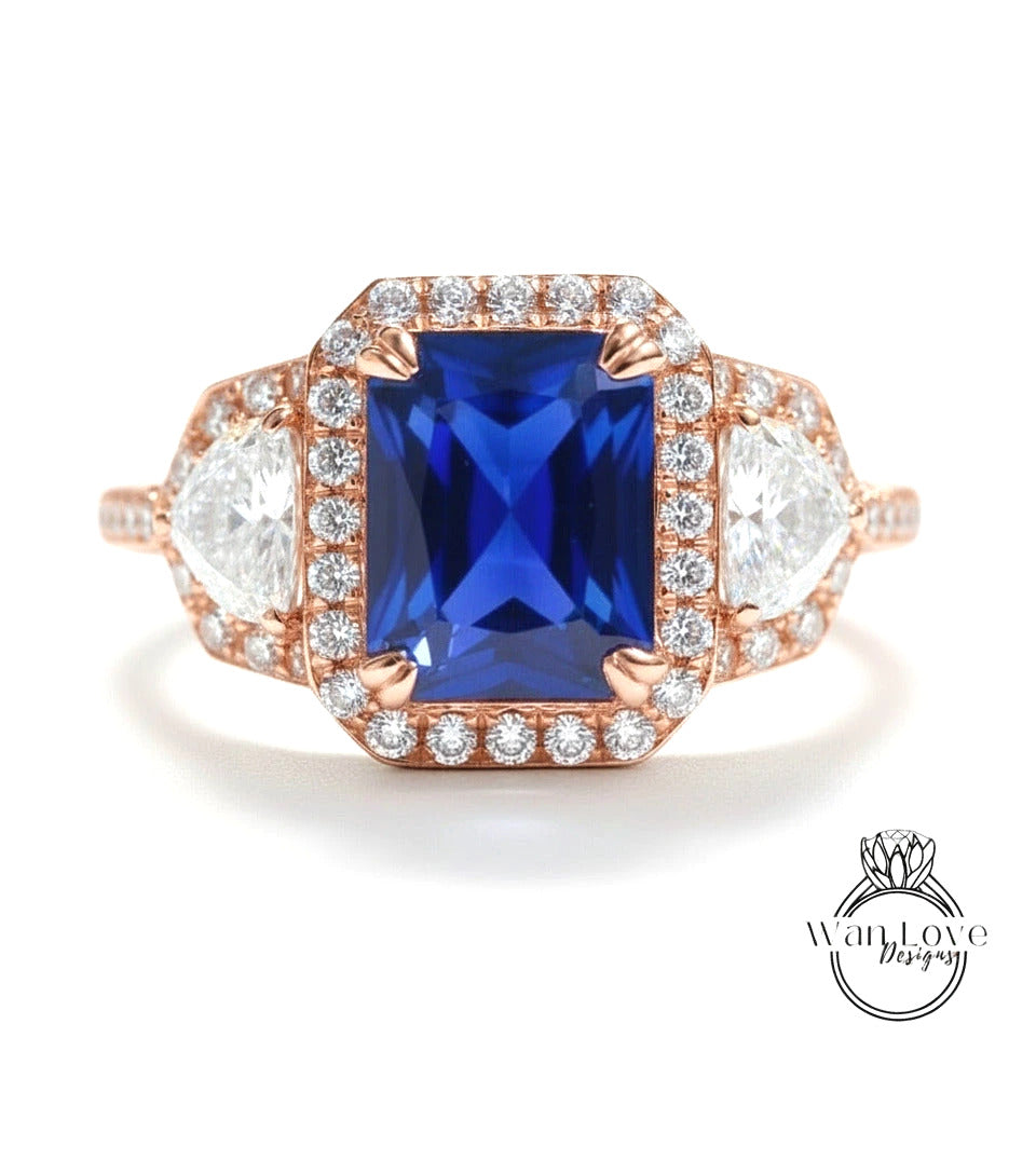A stunning engagement ring with a large blue gemstone surrounded by smaller diamonds, set in a rose gold band.