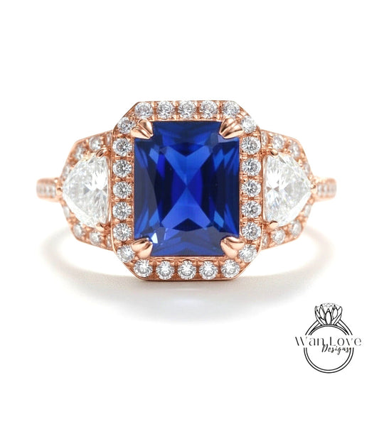 A stunning engagement ring with a large blue gemstone surrounded by smaller diamonds, set in a rose gold band.