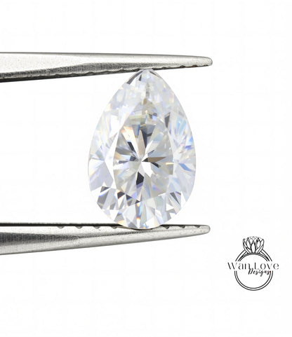 A close-up image of a diamond ring being held in a pair of tweezers.