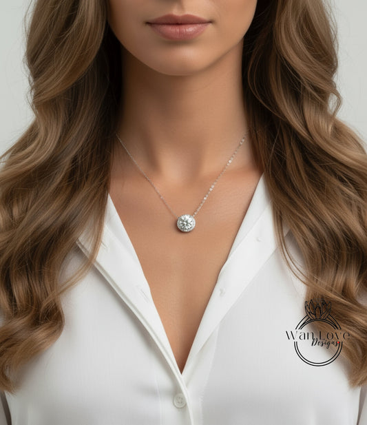 A close-up of a woman's neck and chest area, featuring a necklace with a pendant.