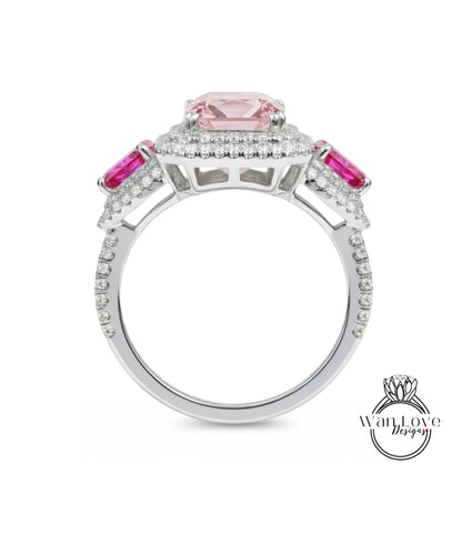 A silver ring with a large pink gemstone at the center, surrounded by smaller pink gemstones.