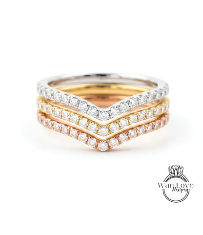 A close-up view of a ring with three concentric bands of diamonds, showcasing the intricate design and craftsmanship.