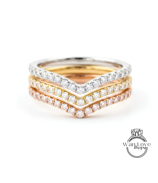 A close-up view of a ring with three concentric bands of diamonds, showcasing the intricate design and craftsmanship.