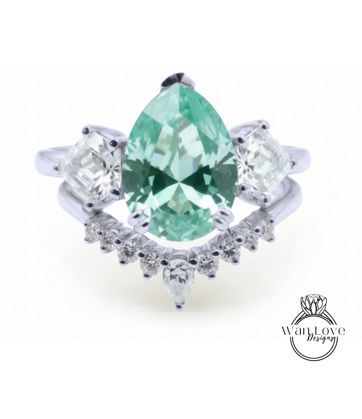 A silver ring with a large, green gemstone at the center, surrounded by smaller diamonds.