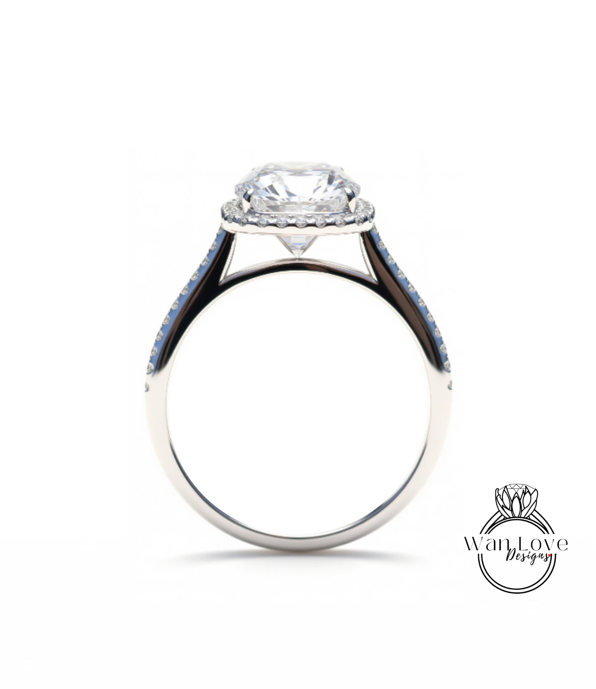 A silver engagement ring with a large central diamond and a halo of smaller diamonds around the center stone.