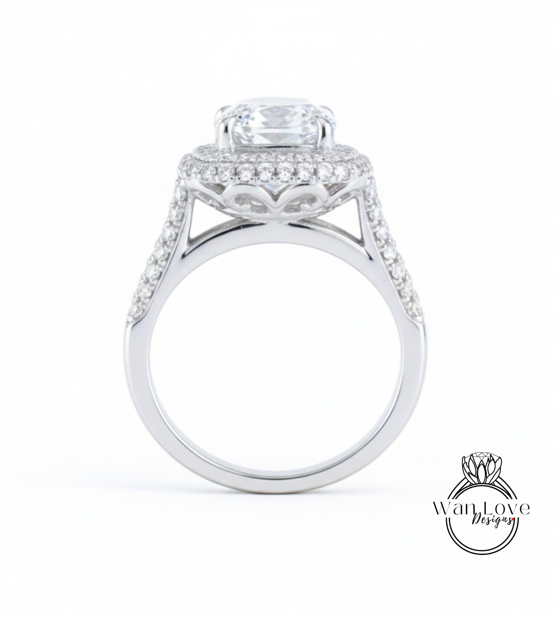 A close-up of a silver ring with a large, round diamond at the center, surrounded by smaller diamonds.