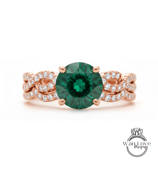A rose gold ring with a large green gemstone at the center, surrounded by smaller diamonds.